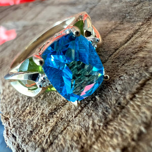 14ky Swiss blue topaz and peridot ring