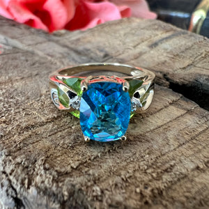 14ky Swiss blue topaz and peridot ring